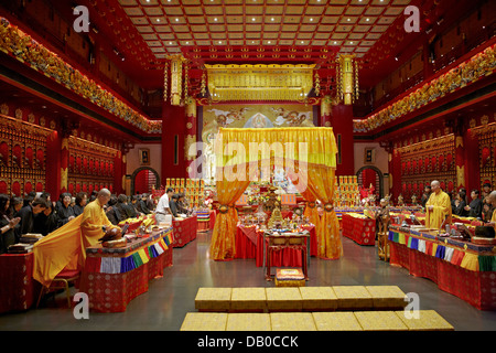 Buddhist ritual ceremony in Buddha Tooth Relic Temple. Chinatown, Singapore. Stock Photo