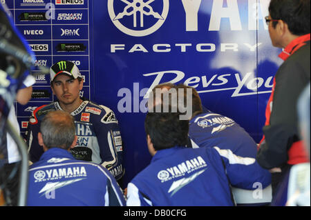 Monterey, California, USA. 21st July, 2013. Yamaha Factory Racing Rider JORGE LORENZO of Spain (99) gives his team some feedback on how the bike handled during warm up for the 2013 Red Bull U.S. Grand Prix. Credit:  Scott Beley/ZUMAPRESS.com/Alamy Live News Stock Photo