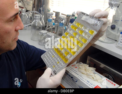 A scientist examines samples from the Danube river in Regensburg, Germany, 14 August 2007. Many European scientists start for a major Danube river expedition from the Black Forest to the Black Sea examining the water quality of Europe's second longest river at 95 test points. The results of the expedition are aimed to develop new concepts in protection of the river. Photo: Armin We Stock Photo