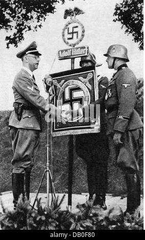 Himmler, Heinrich, 7.10.1900 - 23.5.1945, German politician (NSDAP), full length, Reichsfuehrer-SS 6.1.1929 - 24.4.1945, presents a new standard to the Leibstandarte 'Adolf Hitler',1940, right: SS-Obergruppenfuehrer Josef 'Sepp' Dietrich, Stock Photo