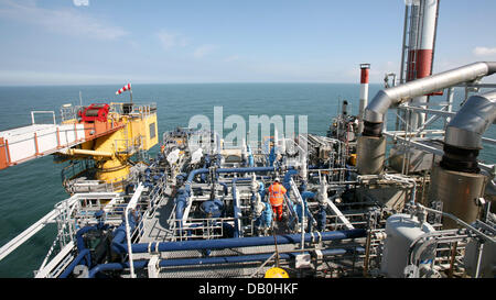 An employee of energy company Wintershall works on offshore platform L8 ...