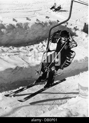 festivities, carnival, carnival on skis, costumed skier siting on chairlift, Firstalm, Schliersee, 1957, Additional-Rights-Clearences-Not Available Stock Photo