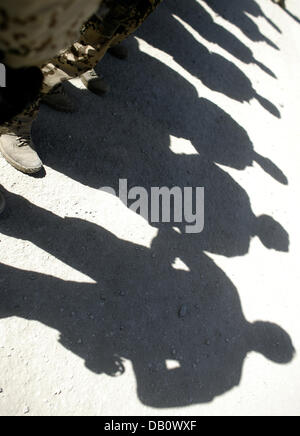 Bundeswehr soldiers stand in a line during the reception with military ...
