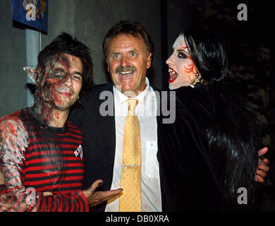 Singer Marc Terenzi (L), his wife and singer Sarah Connor, both in gory costumes, are pictured with the CEO of the Europapark Roland Mack (C) at the adventure park 'Europark' in Rust, Germany, 02 October 2007. The horror show 'Terenzi Horror Nights' runs until 04 November 2007 at the park. Photo: Patrick Seeger Stock Photo
