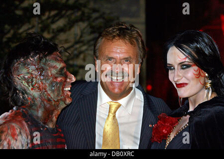 Singer Marc Terenzi (L), his wife and singer Sarah Connor, both in gory costumes, are pictured with the CEO of the Europapark Roland Mack (C) at the adventure park 'Europark' in Rust, Germany, 02 October 2007. The horror show 'Terenzi Horror Nights' runs until 04 November 2007 at the park. Photo: Patrick Seeger Stock Photo