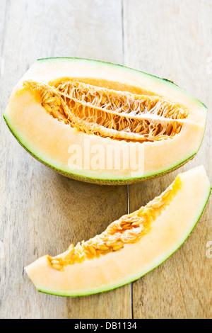 Halve Cantaloupe on wood board Stock Photo