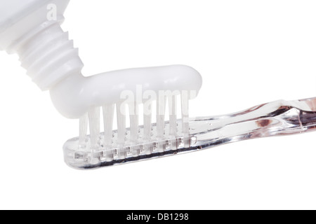 toothbrush and squeezed paste from tube close up isolated on white background Stock Photo