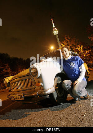 Daniela Feindor a member of Trabi-Team-Stuttgart poses with a Trabbi in front of the television tower in Stuttgart, Germany, 4 November 2007. 50 years ago the first car of the 'Nullserie' (zero series) was manufactured for the public. The car has since gained a cult status with fans all over the world. Photo: Marijan Murat Stock Photo