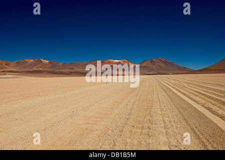 dirt road in landscape of Reserva Nacional de Fauna Andina Eduardo Abaroa, Bolivia, South America Stock Photo