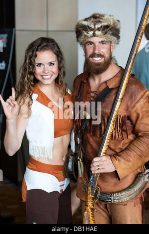 Dallas, Texas, USA. 22nd July, 2013. July 22, 2103: University of Texas Cheerleader and West Virginia Mountaineer pose for a photo during the 2013 Big 12 Conference Football Media Days at the Omni Dallas Hotel in Dallas, TX. Credit:  csm/Alamy Live News Stock Photo