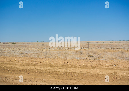 Dry, barren ground in drought conditions in outback Queensland, Australia Stock Photo