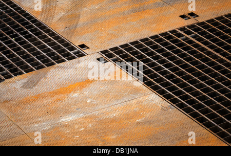 Abstract technology background with rusted metal floor panels and grille Stock Photo