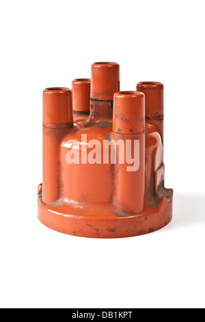 Long exploited and polluted distributor cap on a white background Stock Photo