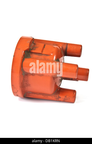 Long exploited and polluted distributor cap on a white background Stock Photo