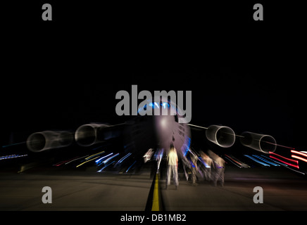 Aircrew members perform pre-flight checks on a C-17 Globemaster III before takeoff to practice combat on-loading and off-loading July 17, 2013, at Joint Base Charleston - Air Base, S.C. Airmen from the 437th Airlift Wing work around the clock on the fligh Stock Photo