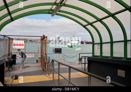 The landing stage at Portsmouth Harbour, with the Gosport Ferry arriving, Portsmouth, UK Stock Photo
