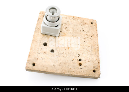 Old fuse on marble panel isolated on white Stock Photo