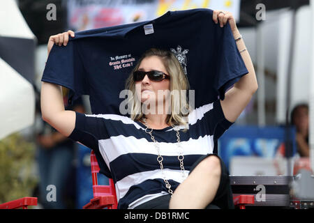 Prescott, AZ, USA. 21st July, 2013. A woman watches musicians during 'Prescott Strong' in Prescott, Arizona. The 8 hour concert benefit honored the 19 Granite Mountain Hotshots killed in the Yarnell fire. Credit:  Krista Kennell/ZUMAPRESS.com/Alamy Live News Stock Photo