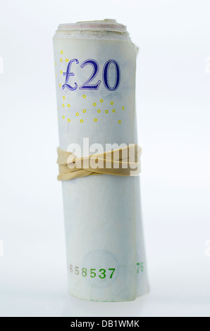 A Roll of Twenty Pound Notes held together with an Elastic Band. Stock Photo