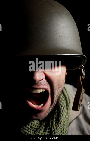 Spotlit portrait of a distraught WW2 American soldier with half his ...