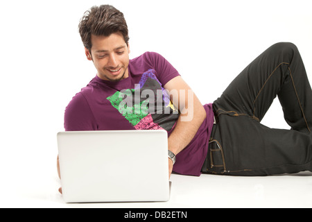 young male relaxed working on laptop Stock Photo
