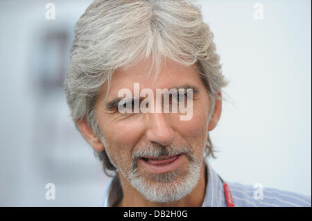 Former British Formula One champion Damon Hill walks through the paddock at the race track Autodromo Nazionale Monza, Italy, 10 September 2011. The Formula One Grand Prix of Italy will take place on 11 September 2011. Photo: David Ebener dpa