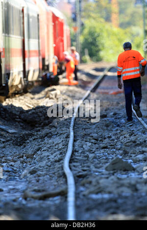 The damage to the tracks is clearly visible after the derailed train cars have been removed from the accident site on the West Rhine Railway in St. Goar, Germany, 12 September 2011. A passenger train derailed due to a landslide after heavy rain. 15 of the 800 passengers as well as the train driver were injured. The West Rhine Railway is expected to be closed between Boppard and Obe Stock Photo