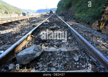 The damage to the tracks is clearly visible after the derailed train cars have been removed from the accident site on the West Rhine Railway in St. Goar, Germany, 12 September 2011. A passenger train derailed due to a landslide after heavy rain. 15 of the 800 passengers as well as the train driver were injured. The West Rhine Railway is expected to be closed between Boppard and Obe Stock Photo