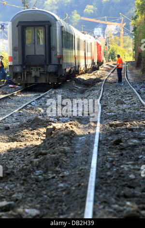 The damage to the tracks is clearly visible after the derailed train cars have been removed from the accident site on the West Rhine Railway in St. Goar, Germany, 12 September 2011. A passenger train derailed due to a landslide after heavy rain. 15 of the 800 passengers as well as the train driver were injured. The West Rhine Railway is expected to be closed between Boppard and Obe Stock Photo