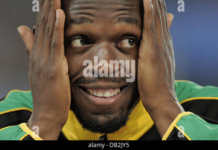 Usain Bolt from Jamaica on the podium during the medal ceremony for the mens 200m during the 13th IAAF World Championships in Daegu, Republic of Korea, 04 September 2011. Photo: Rainer Jensen dpa Stock Photo