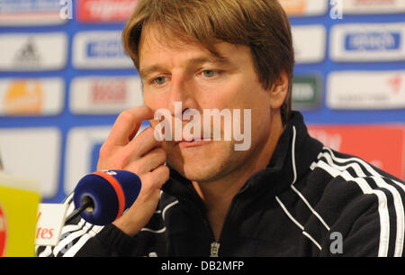 Hamburg's head coach Michael Oenning touches his face during a press conference after the German Bundesliga match between Hamburg SV and Borussia Moenchengladbach at Imtech Arena in Hamburg, Germany, 17 September 2011. HSV was defeated 0-1. Photo: MARCUS BRANDT (ATTENTION: EMBARGO CONDITIONS! The DFL permits the further utilisation of the pictures in IPTV, mobile services and other Stock Photo