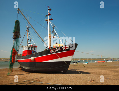 Fishing boat at West Mersea harbour stand Stock Photo