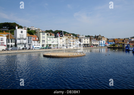 The boating lake and buildings on Hastings Old Town seafront, East Sussex, South East England Stock Photo