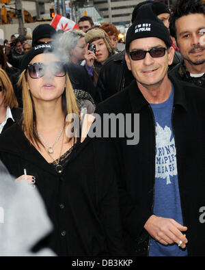 Charlie Sheen and his goddess Natalie Kenly leave his hotel and walk to