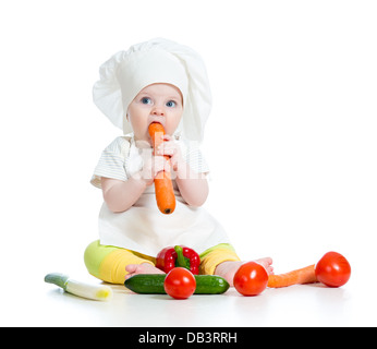 cook baby girl eating healthy food isolated on white Stock Photo