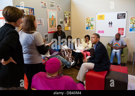 President Barack Obama talks with students in a health education class while touring the Desmond Tutu HIV Foundation Youth Centre in Cape Town, South Africa, June 30, 2013. Stock Photo