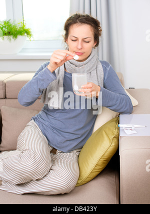 Ill Woman Taking Aspirin Pills. Headache. Medicines Stock Photo