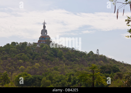 Buddha statue on mountain in thailand Stock Photo