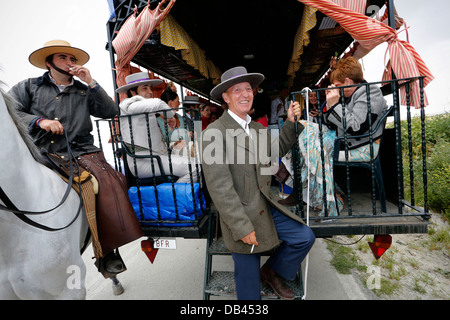 Spanish Catholic pilgrims traveling in a caraven and making the annual pilgrimage to El Rocio in Andalusia, southern Spain Stock Photo