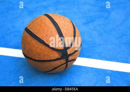 old basketball on a court Stock Photo