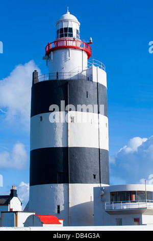 The famous striped paint job Hook lighthouse located at Hook head is one of the oldest lighthouses in the world in Count Wexford Stock Photo