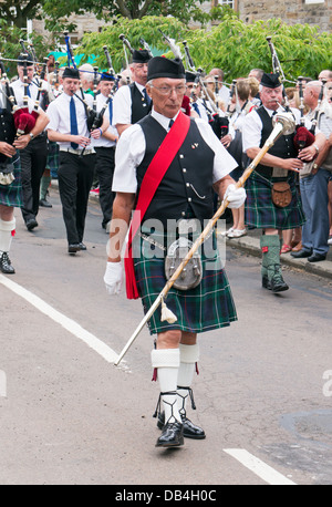 Rothbury Highland Pipe Band marching through the town, Rothbury Traditional Music Festival, northern England, UK Stock Photo