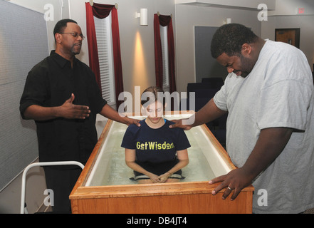 A young girls gets baptized during a church service in Riverdale Park, Maryland Stock Photo