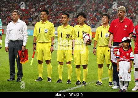 Nagoya, Japan. 22nd , 2013. (L-R) Dragan Stojkovic (Grampus), Arsene Wenger (Arsenal) Football / Soccer : Nagoya Grampus head coach Dragan Stojkovic (L) and Arsenal manager Arsene Wenger (R) pose with referees before the Pre-season friendly match between Nagoya Grampus 1-3 Arsenal at Toyota Stadium in Nagoya, Japan . Credit:  Kenzaburo Matsuoka/AFLO/Alamy Live News Stock Photo