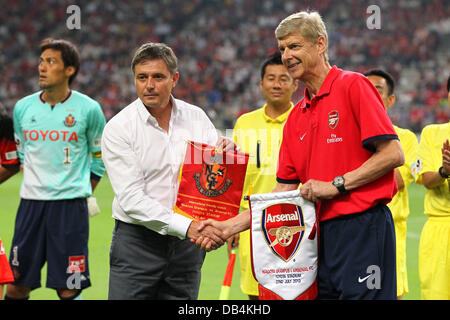 Nagoya, Japan. 22nd , 2013. (L-R) Dragan Stojkovic (Grampus), Arsene Wenger (Arsenal) Football / Soccer : Nagoya Grampus head coach Dragan Stojkovic shakes hands with Arsenal manager Arsene Wenger before the Pre-season friendly match between Nagoya Grampus 1-3 Arsenal at Toyota Stadium in Nagoya, Japan . Credit:  Kenzaburo Matsuoka/AFLO/Alamy Live News Stock Photo