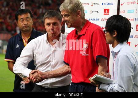 Nagoya, Japan. 22nd , 2013. (L-R) Dragan Stojkovic (Grampus), Arsene Wenger (Arsenal) Football / Soccer : Nagoya Grampus head coach Dragan Stojkovic shakes hands with Arsenal manager Arsene Wenger after the Pre-season friendly match between Nagoya Grampus 1-3 Arsenal at Toyota Stadium in Nagoya, Japan . Credit:  Kenzaburo Matsuoka/AFLO/Alamy Live News Stock Photo