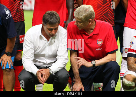 Nagoya, Japan. 22nd , 2013. (L-R) Dragan Stojkovic (Grampus), Arsene Wenger (Arsenal) Football / Soccer : Nagoya Grampus head coach Dragan Stojkovic talks with Arsenal manager Arsene Wenger after the Pre-season friendly match between Nagoya Grampus 1-3 Arsenal at Toyota Stadium in Nagoya, Japan . Credit:  Kenzaburo Matsuoka/AFLO/Alamy Live News Stock Photo