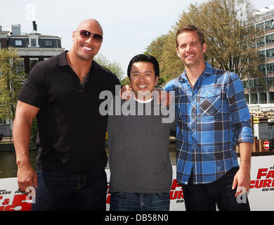 Dwayne Johnson, aka The Rock, Director, Justin Lin and Paul Walker attend a Photocall for 'Fast & Furious 5: Rio Heist' outside the Pathe Arena Amsterdam, Netherlands - 26.04.11 Stock Photo