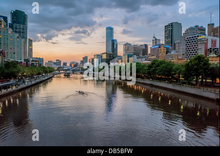 Rowers exercise at sunset on Melbourne's Yarra River. Australia. Stock Photo