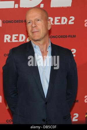 Munich, Germany. 24th July, 2013. US actor Bruce Willis poses for the camera during a photocall for his new film 'R.E.D.2' at Hotel Manadrin Oriental in Munich, Germany, 24 July 2013. The film is featured in German cinemas on 12 September 2013. Photo: Ursula Dueren/dpa/Alamy Live News Stock Photo